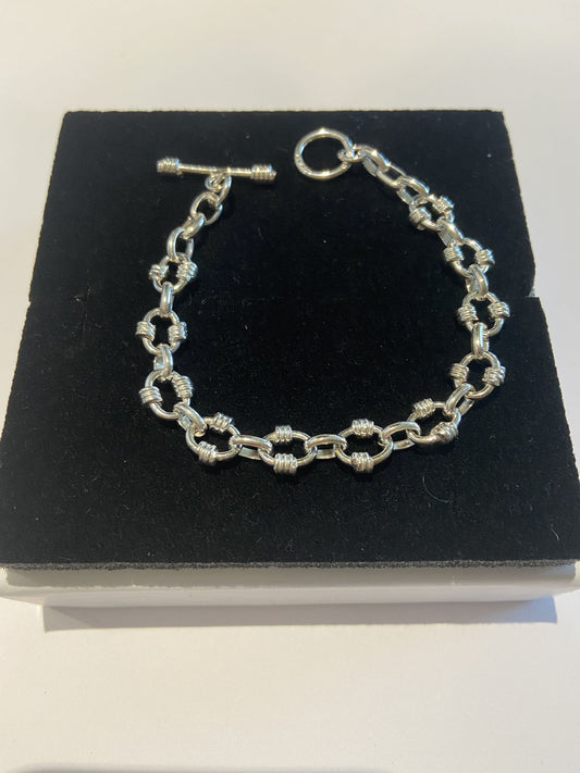 Silver Bracelet with unusual twists around every oval link